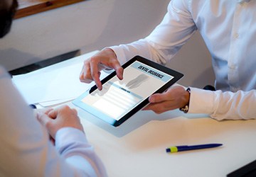 A man discussing dental insurance with an insurance agent